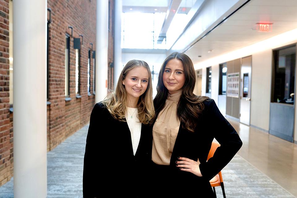 two students in professional suits